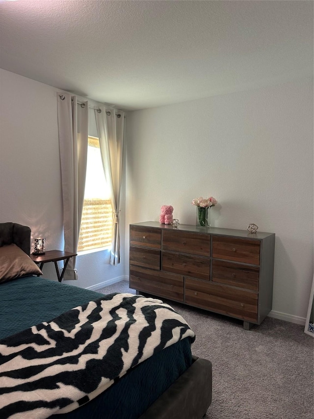 bedroom with light colored carpet