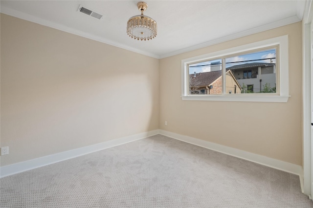 carpeted empty room with ornamental molding