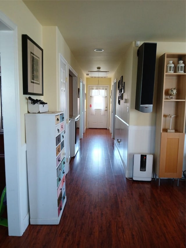 doorway with dark wood-style floors