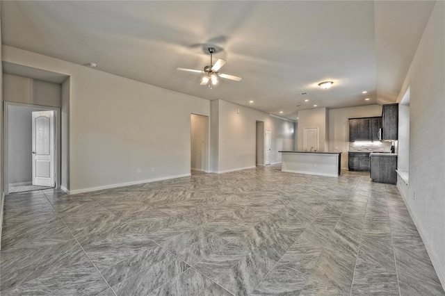 unfurnished living room with ceiling fan