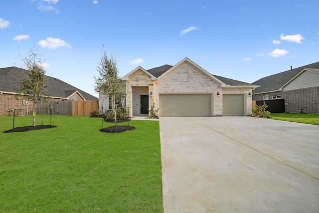 view of front facade with an attached garage, brick siding, fence, driveway, and a front lawn