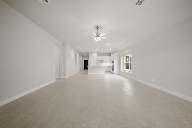 unfurnished living room with ceiling fan, recessed lighting, visible vents, and baseboards