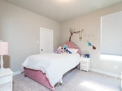 bedroom featuring light colored carpet