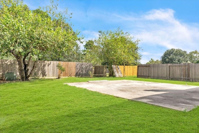 view of yard with basketball court