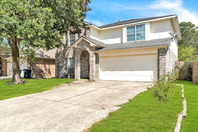 view of front of house with a garage and a front lawn