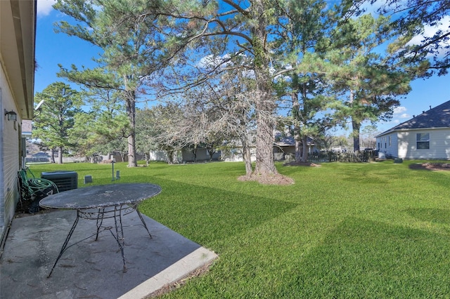 view of yard with a patio and central AC