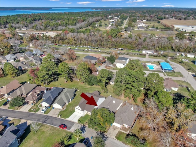 bird's eye view with a water view