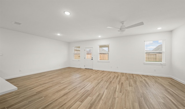 spare room featuring visible vents, baseboards, light wood-style flooring, and recessed lighting