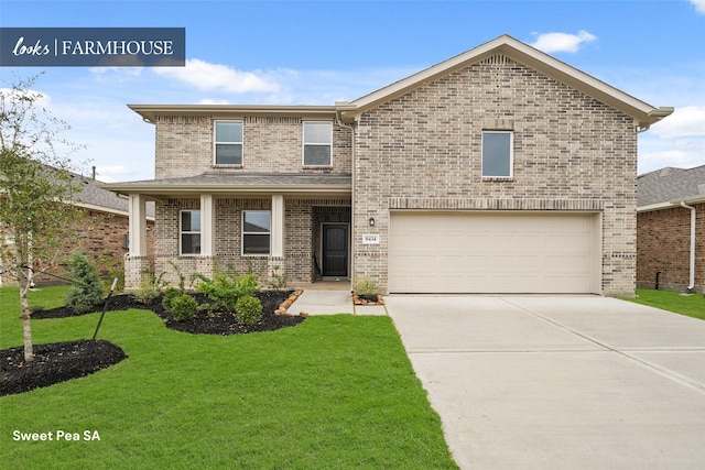 view of front of house featuring a garage, driveway, a front lawn, and brick siding