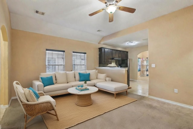 living room featuring ceiling fan and light colored carpet