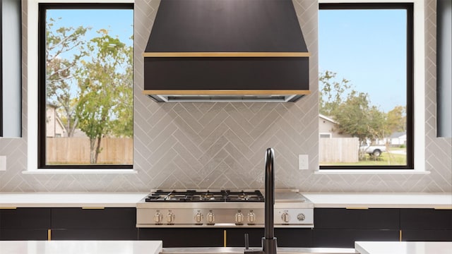 interior details featuring stainless steel gas stovetop and tasteful backsplash