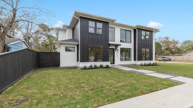 view of front of home with a front lawn