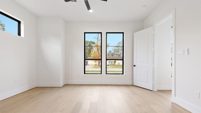 spare room featuring ceiling fan and light hardwood / wood-style floors