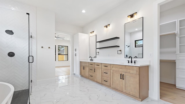 bathroom featuring vanity, ceiling fan, and plus walk in shower