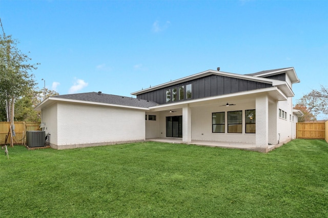 back of property with a patio, ceiling fan, a lawn, and central air condition unit