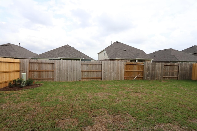 view of yard with a fenced backyard