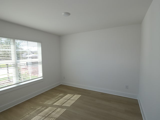 8622 Sun Coral Dr, Cypress, TX 77433 - empty room featuring wood finished floors and baseboards