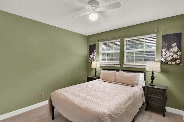 bedroom with ceiling fan and light hardwood / wood-style floors