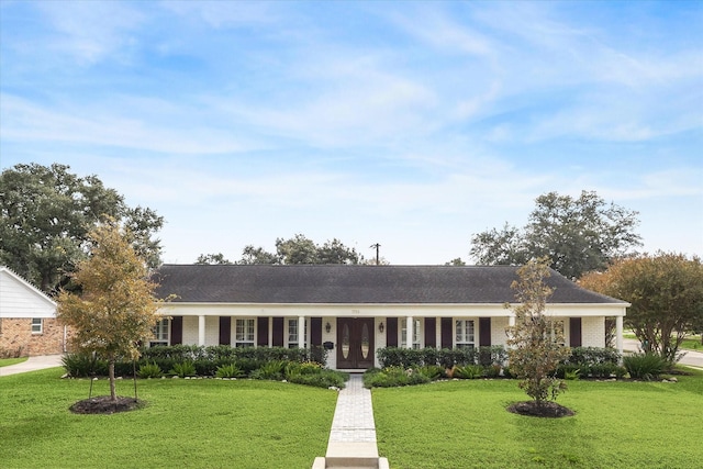 single story home with brick siding and a front yard