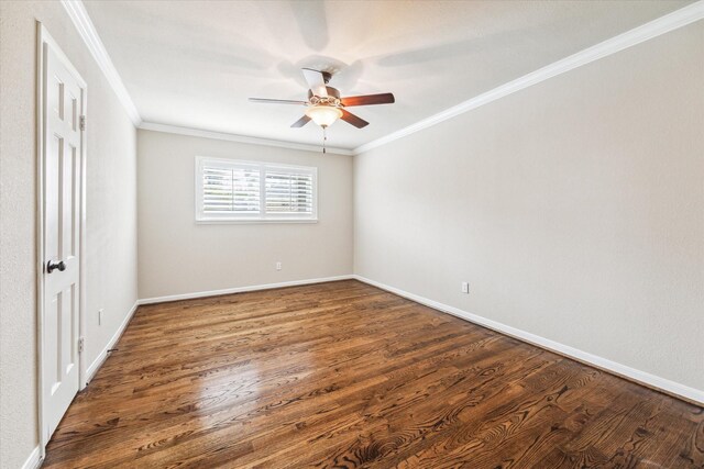 unfurnished bedroom featuring ornamental molding, ceiling fan, and dark wood-type flooring