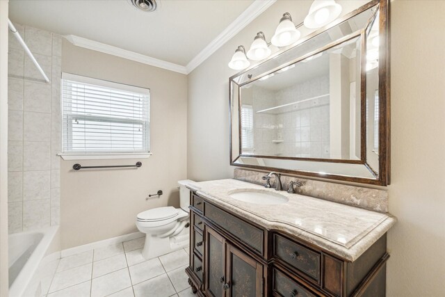 full bathroom featuring vanity, tiled shower / bath, tile patterned flooring, toilet, and ornamental molding