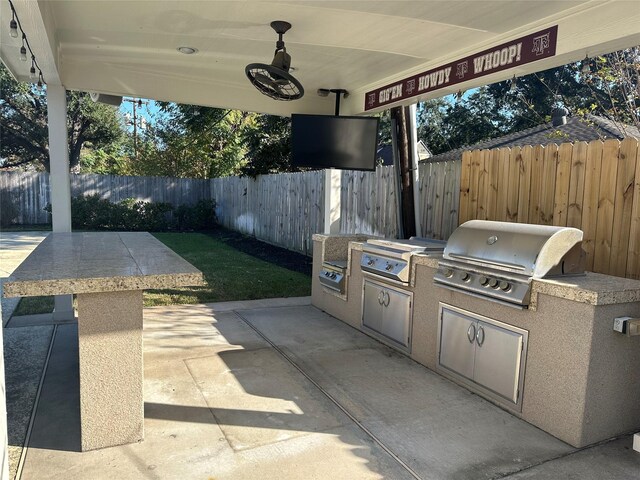 view of patio / terrace with exterior kitchen and grilling area