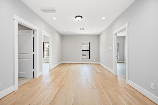 unfurnished room featuring light wood-type flooring