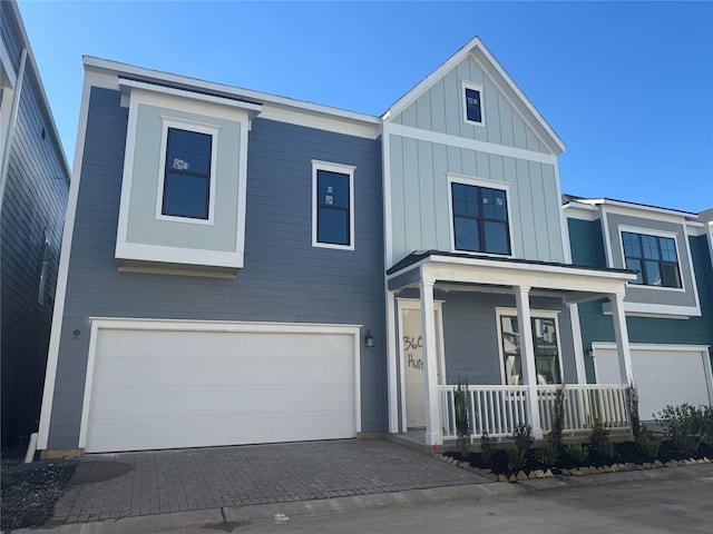 view of front of house with a garage and covered porch