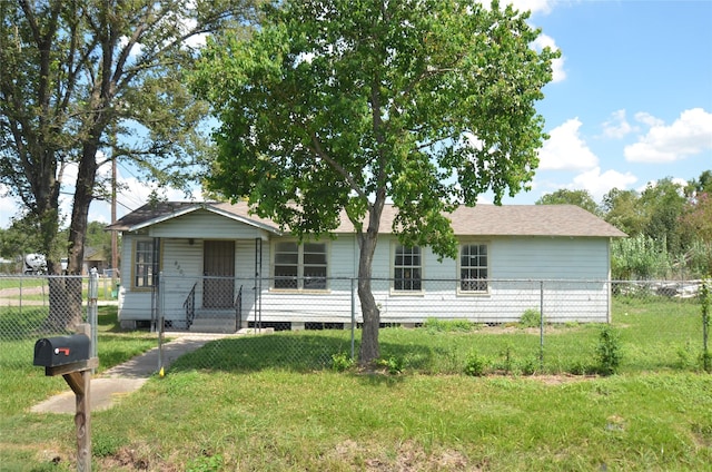 ranch-style home with a front lawn