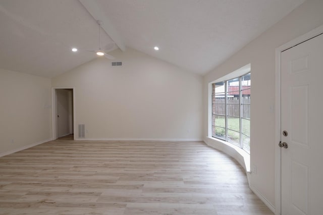 interior space featuring lofted ceiling with beams, ceiling fan, and light wood-type flooring