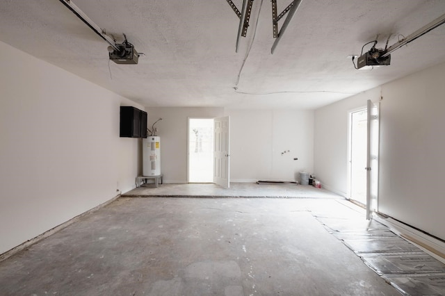 garage with electric water heater and a garage door opener