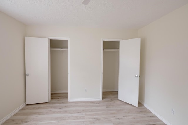 unfurnished bedroom featuring light hardwood / wood-style flooring and a textured ceiling