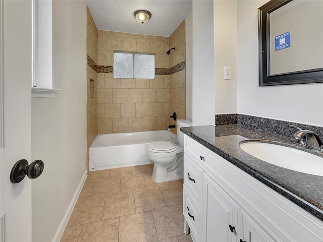 full bathroom with tile patterned flooring, tiled shower / bath combo, toilet, and vanity