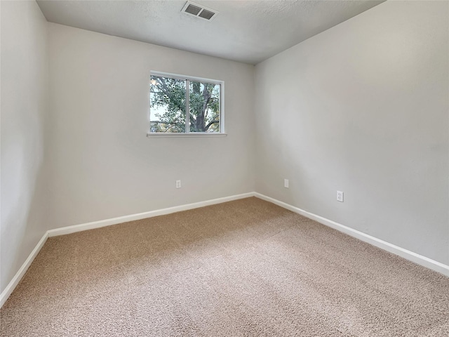 unfurnished room with carpet flooring