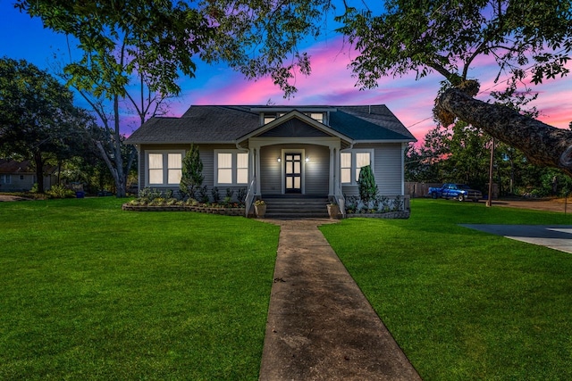 view of front of home with a yard