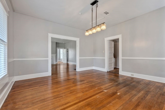 unfurnished room with hardwood / wood-style floors