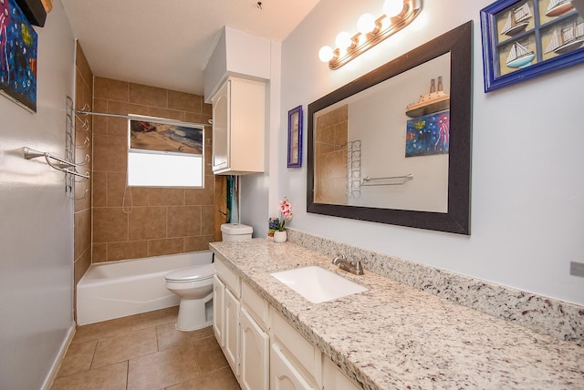 full bathroom with tile patterned flooring, vanity, toilet, and tiled shower / bath combo