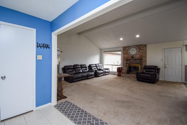 living room with vaulted ceiling with beams, light carpet, and a brick fireplace