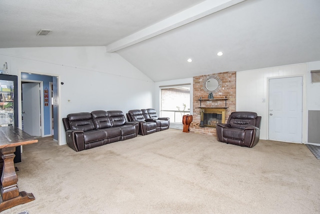 carpeted living room with vaulted ceiling with beams and a brick fireplace