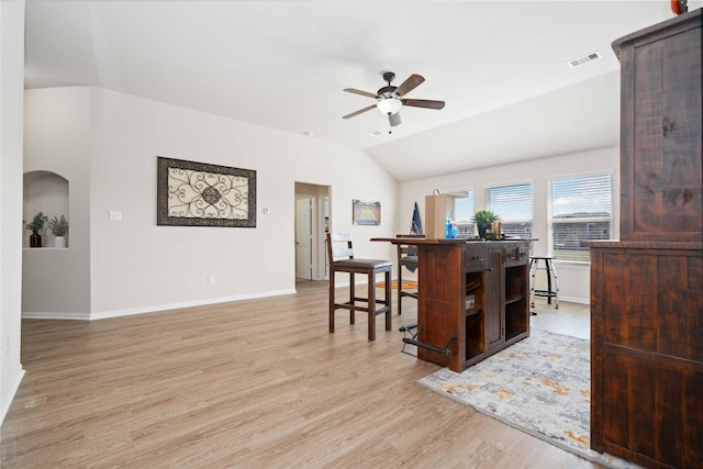 kitchen featuring ceiling fan, lofted ceiling, and light hardwood / wood-style floors