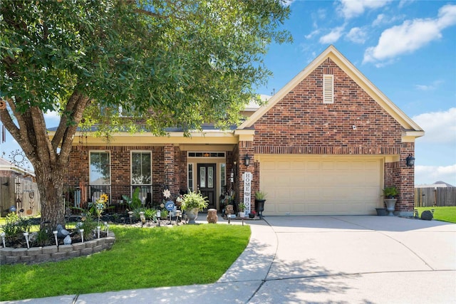 view of front of house featuring a front lawn and a garage