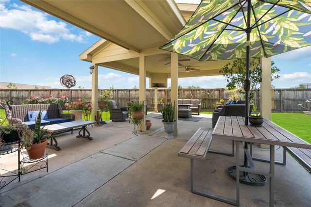 view of patio featuring ceiling fan and an outdoor living space