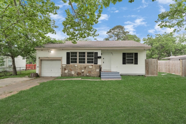 single story home with a front yard and a garage