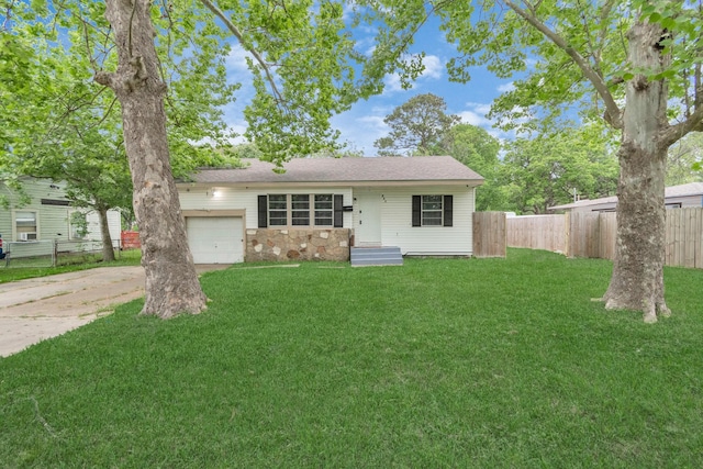 ranch-style house featuring a garage and a front yard