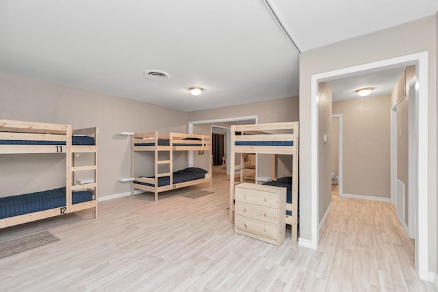 bedroom with light wood-type flooring