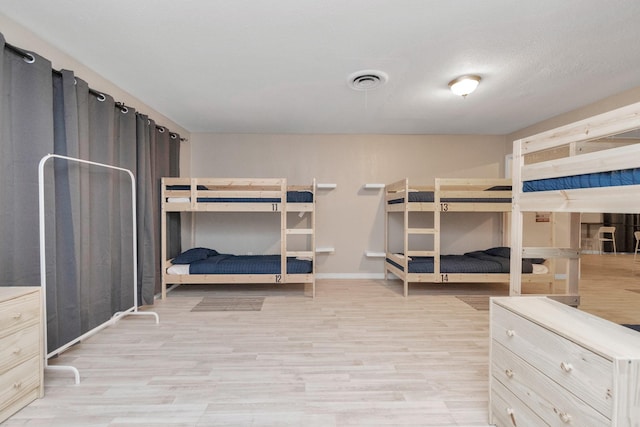 bedroom with light wood-type flooring