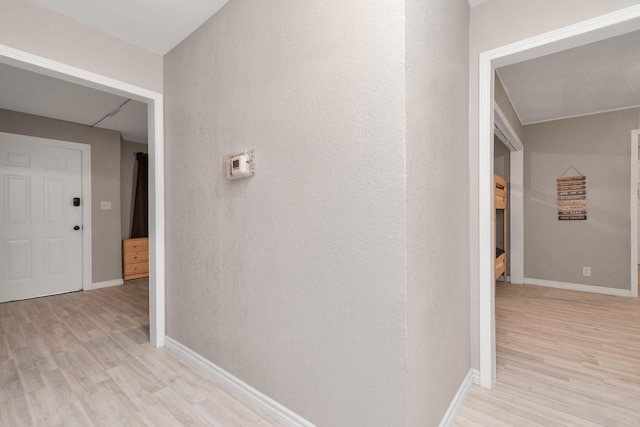 hallway with light wood-type flooring