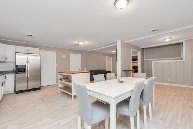 dining area with light hardwood / wood-style flooring