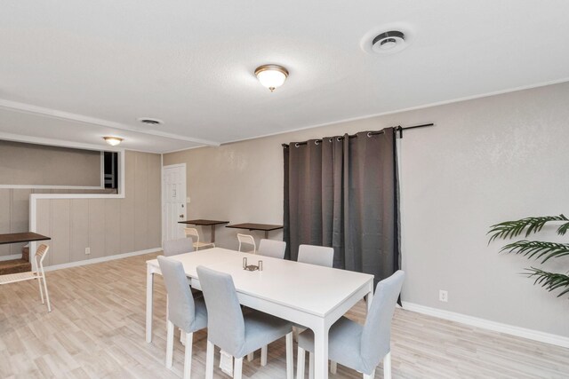 dining space with light wood-type flooring