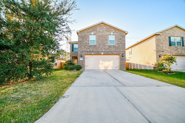 view of front property with a front yard and a garage